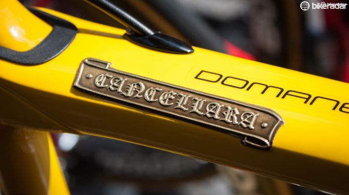 There's more artistic embossed detailing on Cancellara's yellow Trek Domane, this time for the rider's name badge