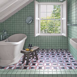 Bathroom with green wall tiles and geometric floor tiles