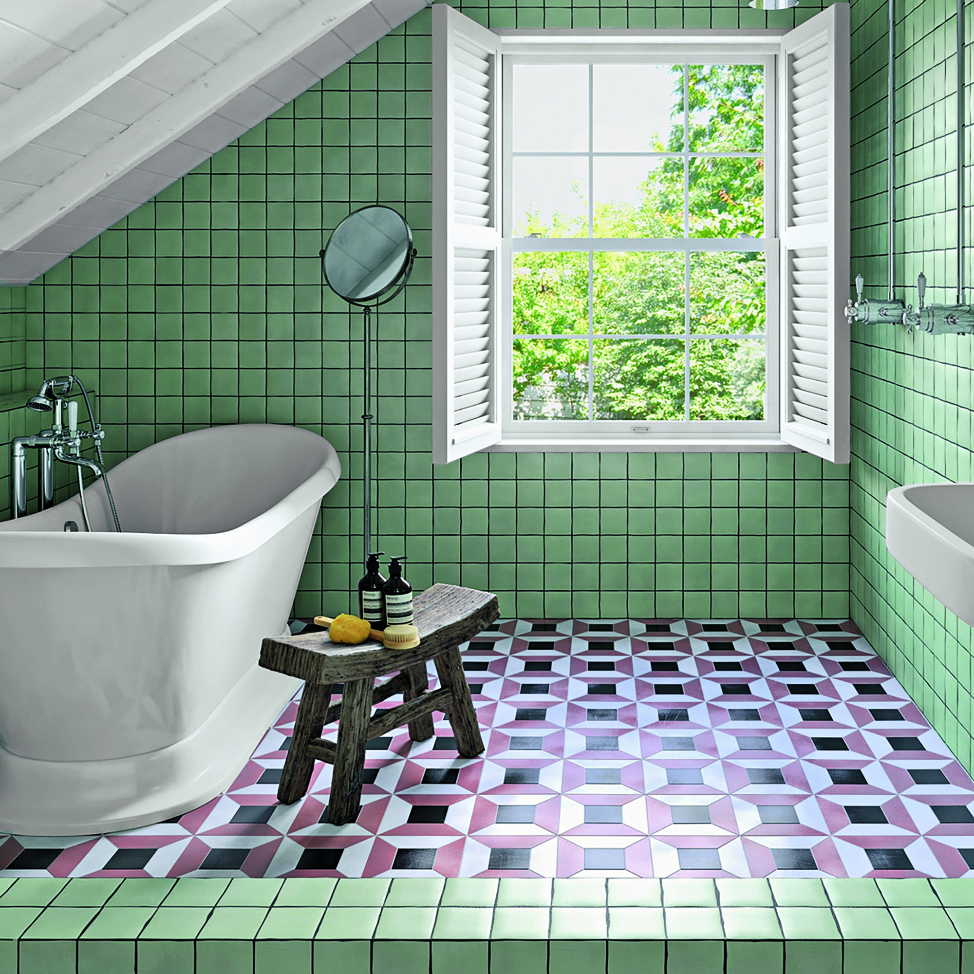 Bathroom with green wall tiles and geometric floor tiles