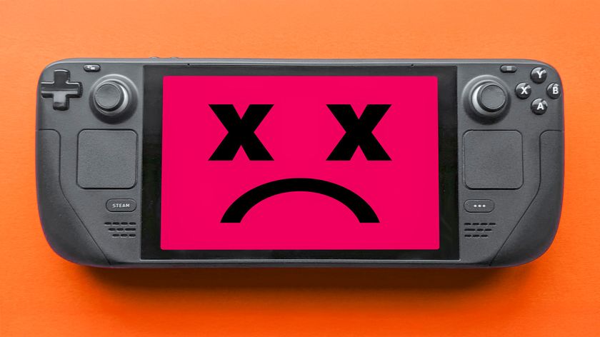 A Steam Deck displaying a red screen with two X-ed out eyes and a frown. 