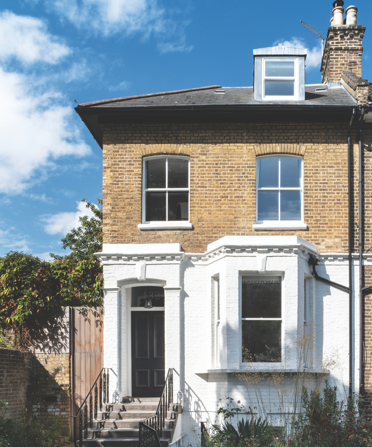 Exterior of semi detached house with lower half painted white
