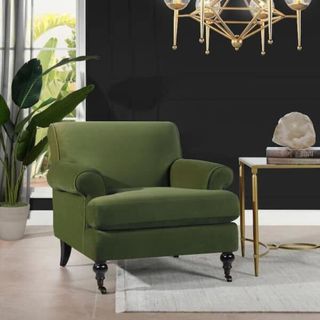 A dark green upholstered armchair from Home Depot