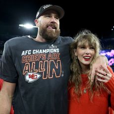 Travis Kelce and Taylor Swift smile together at the AFC Championship