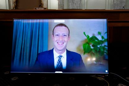 CEO of Facebook Mark Zuckerberg appears on a monitor as he testifies remotely during a hearing to discuss reforming Section 230 of the Communications Decency Act with big tech companies on Oc