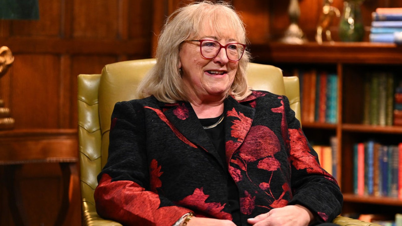 Donna Kelce sitting in a chair.