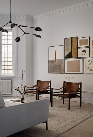 a scandi living room with a gallery wall