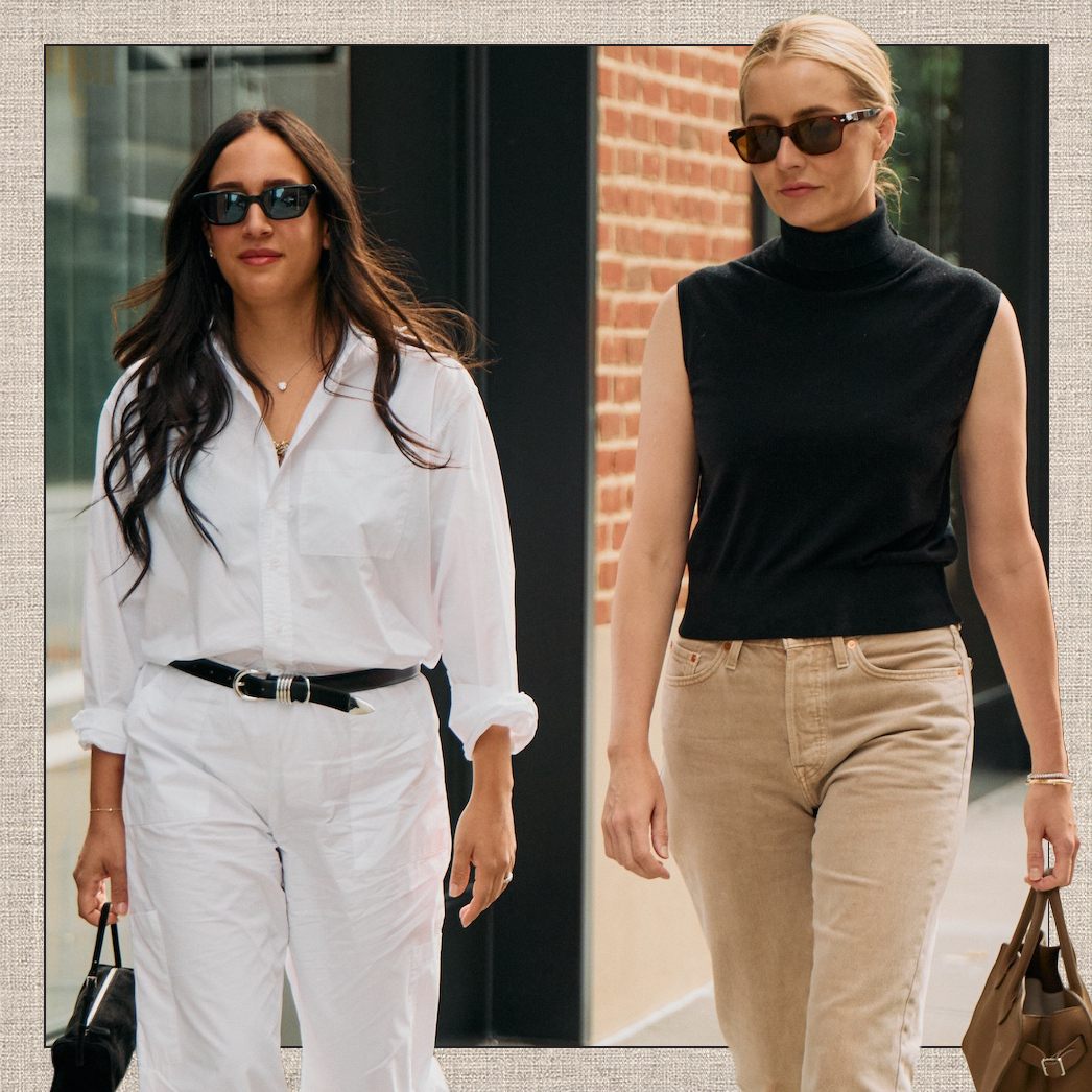 New York Fashion Week NYFW ss26 street style shot of Who What Wear fashion editors Nicole Akhtarzad Eshaghpour and Kristin Nichols wearing chic fall outfit ideas with elevated basics like a white button-down shirt, black belt, black sleeveless turtleneck top, and corduroy pants