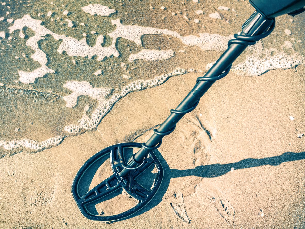 A metal detector on the beach.