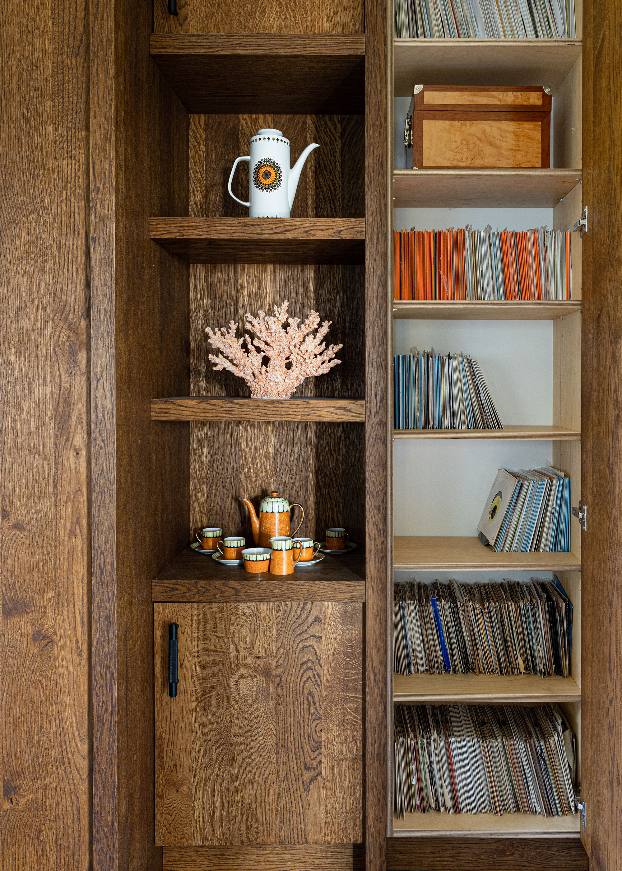 built-in wooden storage with records and books