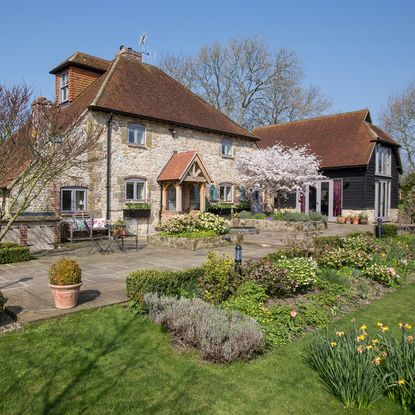 house exterior with front yard garden and flowers