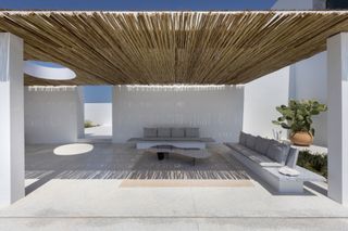 Outdoors seating in Paros island house by studio seilern