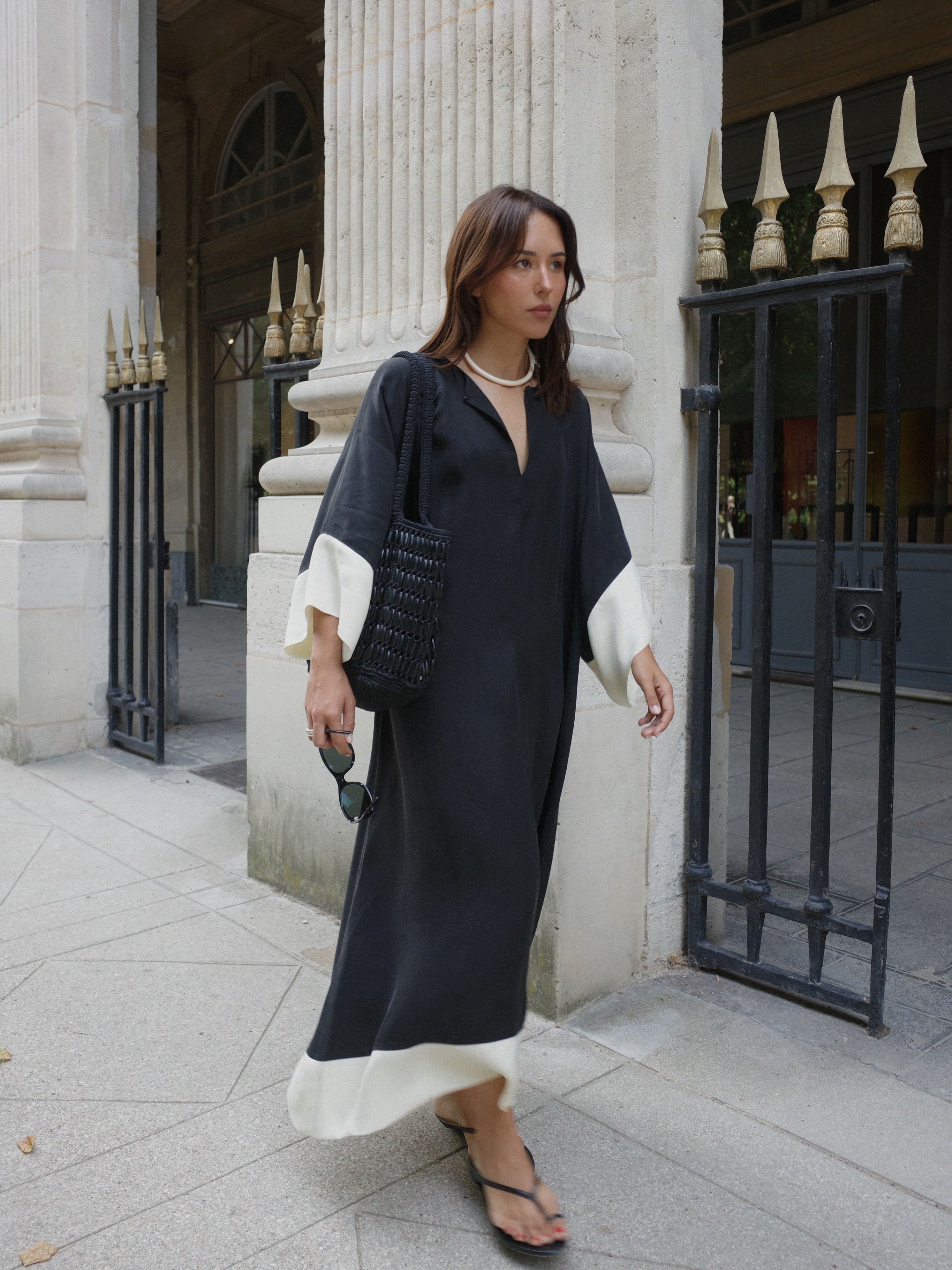 Woman wearing summer dress with flip-flops.