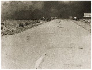 Black and white image of empty road