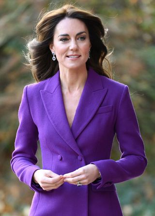 Kate Middleton wearing a purple suit.