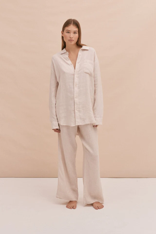best pyjama sets, woman wearing neutral linen shirt and trouser set