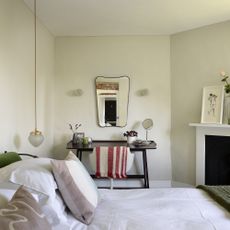 Cream bedroom with fireplace