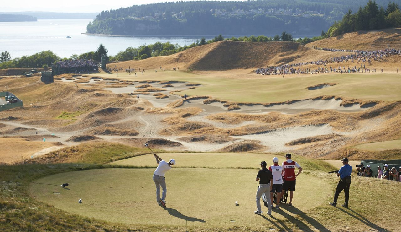 Dustin Johnson hits a tee shot at the 18th hole at Chambers Bay