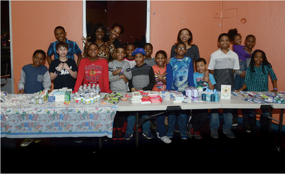 Jahkil (front, gray shirt), his friends, and the makings of their blessing bags.