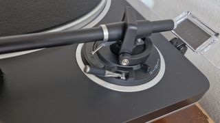 Audio-Technica AT-LP70XBT toggle switch concealed in the turntable's tonearm pivot