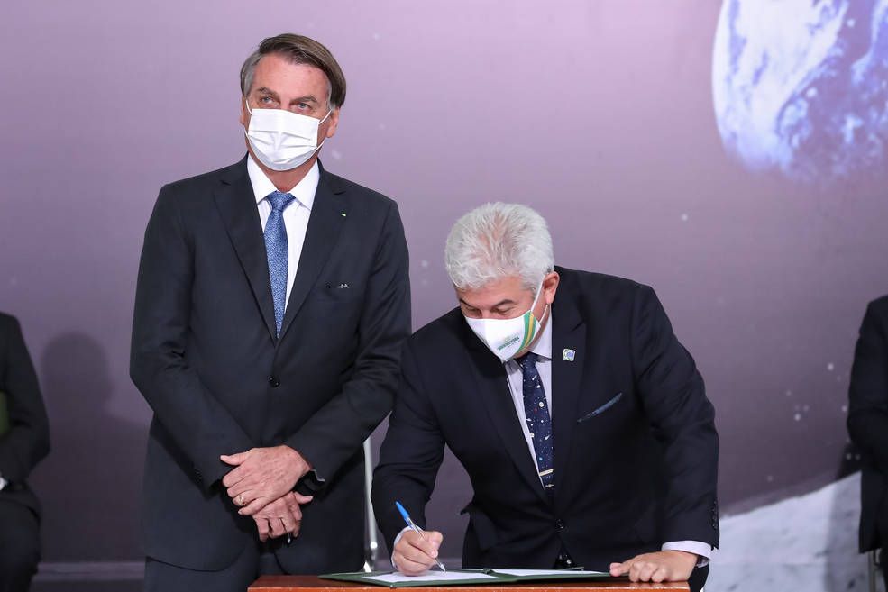 Marcos Pontes, Brazil&#039;s Minister of Science, Technology and Innovation signs the Artemis Accords next to Brazil&#039;s President Jair Bolsonaro on June 15, 2021.