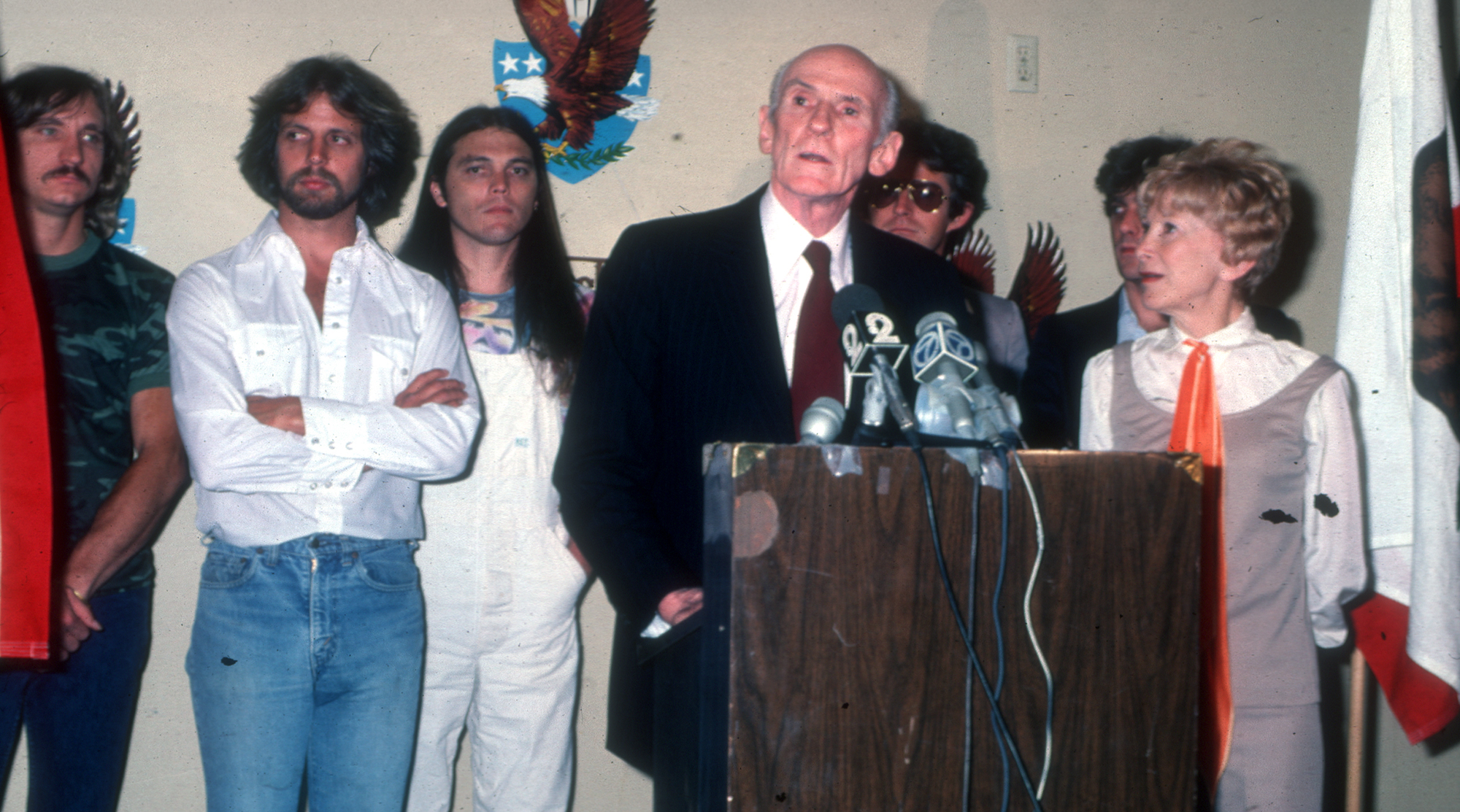 Joe Walsh, Don Felder, Timothy B. Schmit, Alan Cranston, Don Henley, Glenn Frey, and Cranston's wife Norma Weintraub attend an event in 1980