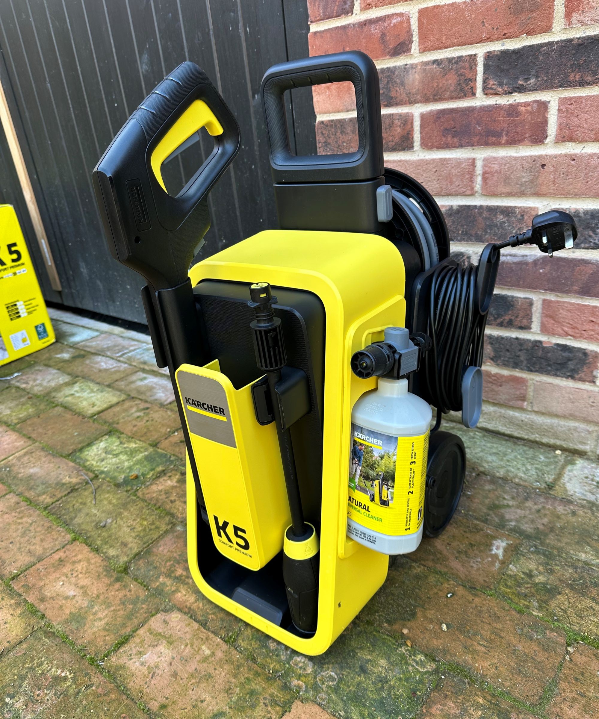 A yellow K&auml;rcher K5 comfort premium pressure washer after unboxing and assembling