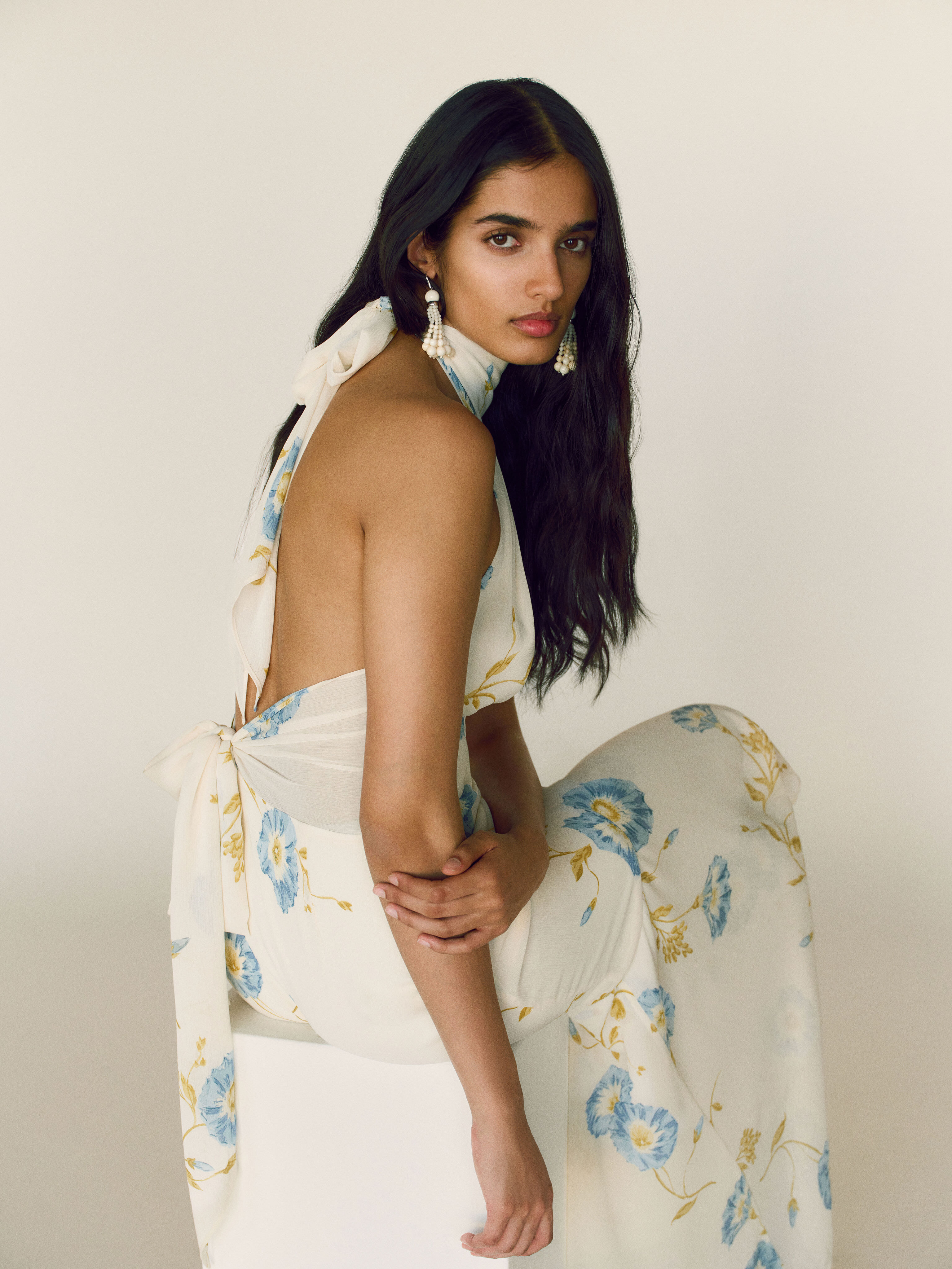 A model wearing a Reformation bridesmaid dress.