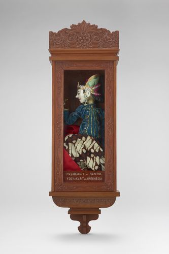A puppet in a wooden case