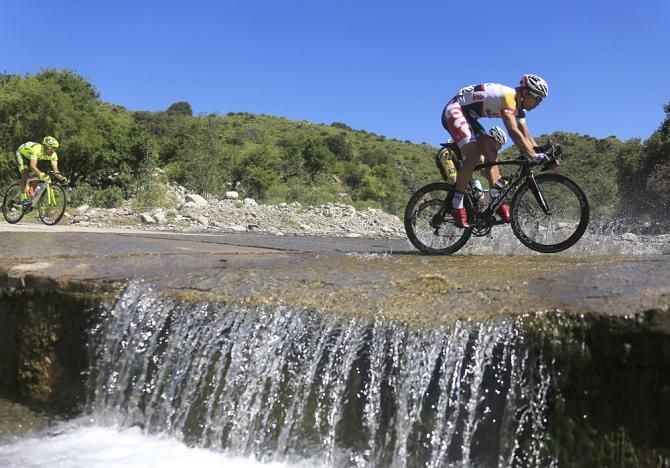 The peloton crosses a stream mid-route in Tour de San Luis