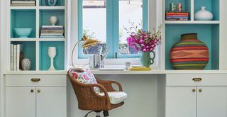 home office desk area with blue painted shelving to suggest a sense of dopamine decor