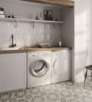 laundry room with patterned floor and grey vertical tiles