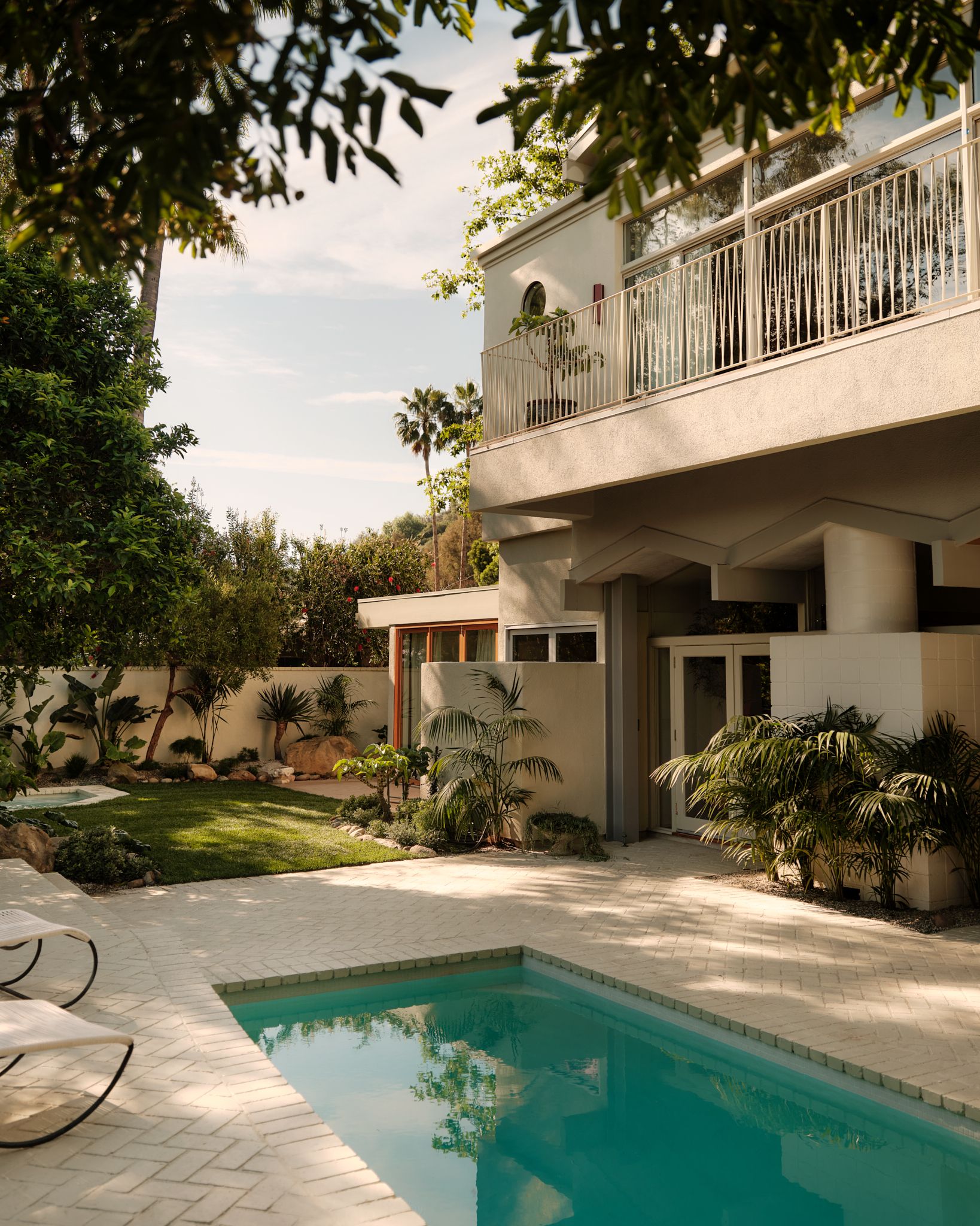 Rear garden with small pool and first floor balcony