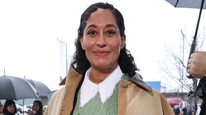 Tracee Ellis Ross wearing a utility style coat with a fringe top
