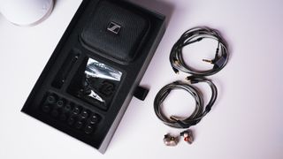 Sennheiser IE600 box contents with 4.4mm and 3.5mm cables on a table