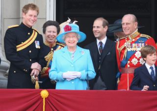 rince Harry, Princess Anne, Princess Royal, Prince Edward, Earl of Wessex, Sophie, Countess of Wessex, HM Queen Elizabeth II and HRH Prince Philip, Duke of Edinburgh, laugh before watching a fly-past over Buckingham Palace after the Trooping the Colour ceremony on June 13, 2009