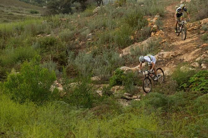 Nino Schurter (front) and Philip Buys of Team SCOTT-Odlo MTB racing break away from the lead group just before reaching Genadendal