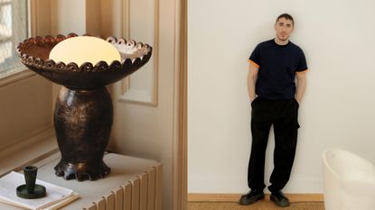 In a split image, the left-hand side of the frame shows a ceramic, warm light in brown sitting on a cream-hued table. On the right, a young man dressed in an all-black outfit stands against a white wall.