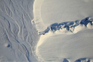 Sinuous melt channels are visible in this image of part of DeVries Glacier in the Canadian Arctic. The Digital Mapping System aboard the P-3 Orion research plane captured this image on March 29, 2017.
