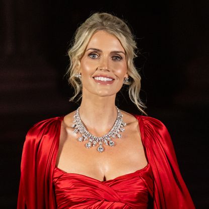 Lady Kitty Spencer wearing a red caped dress
