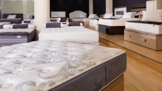 Closeup of new modern orthopaedic mattress on display for sale in large furniture store
