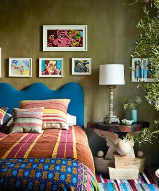 colorful bedroom with green walls and blue bed