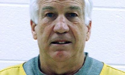 Former Penn State assistant football coach Jerry Sandusky was arrested on new charges Wednesday, including that he sexually abused a young boy who frequently spent the night in Sandusky's bas