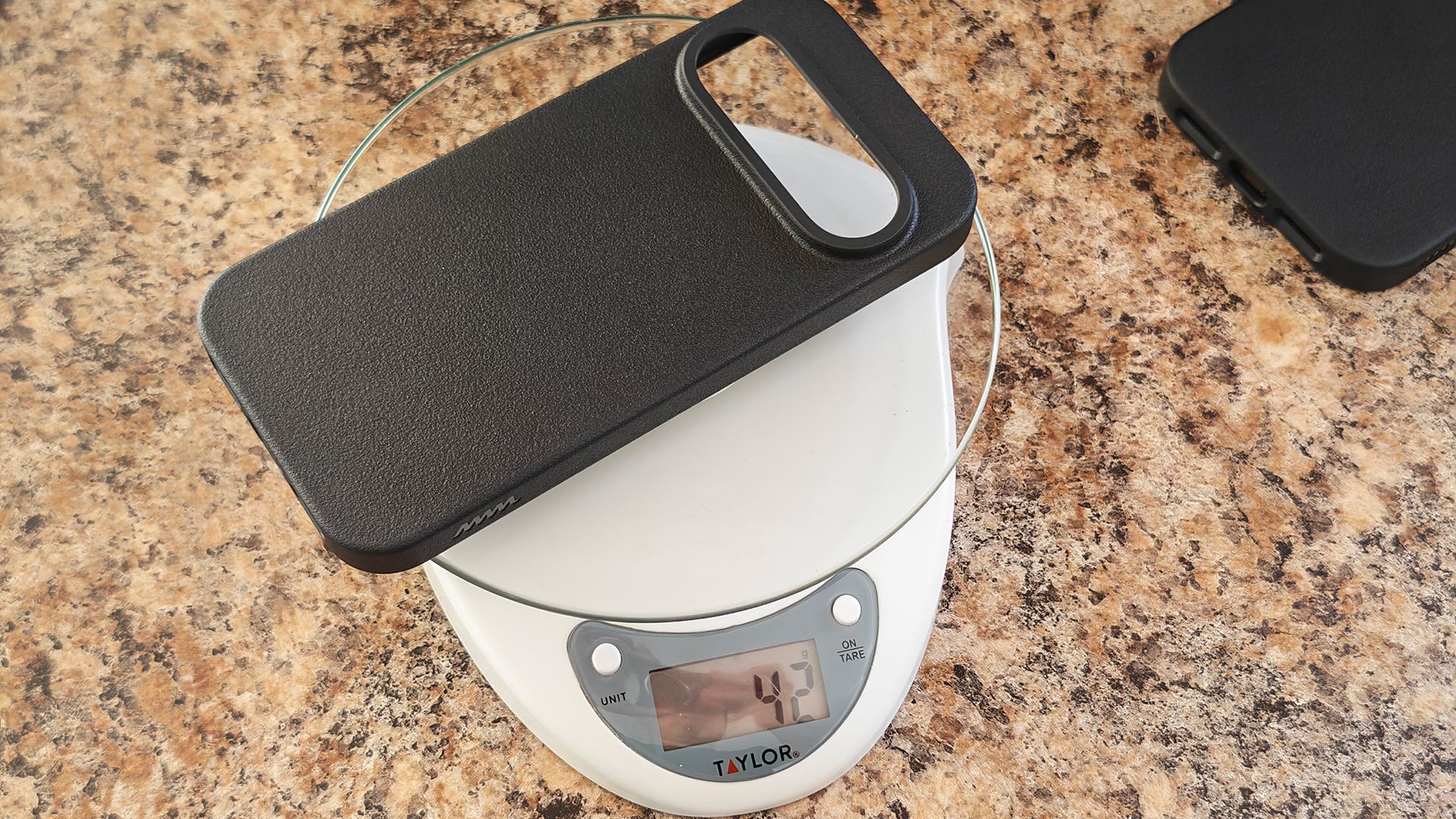 Weighing a Dbrand MNML case for the Pixel 11 Pro