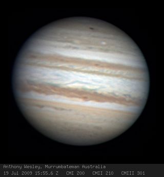 South lies at the top of this Jupiter image taken on July, 19, 2009, by amateur astronomer Anthony Wesley, the discoverer of the impact mark. He used a 14.5-inch telescope at home in Murrumbateman, Australia.