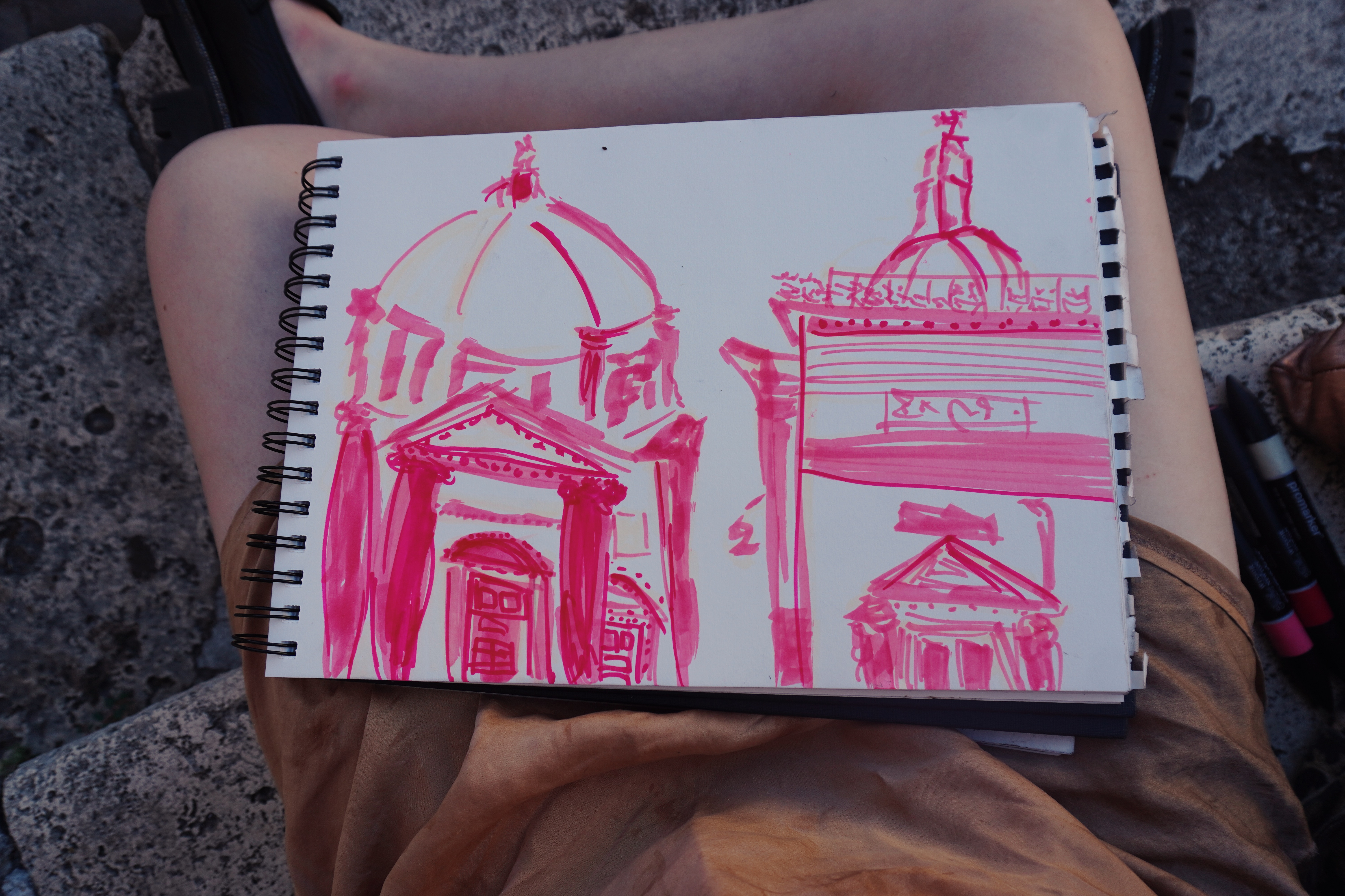 Sketches of Rome in various shades of pink and neutral markers.