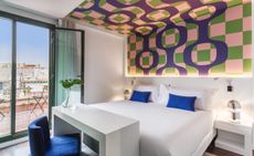 Guestroom with colourful wall & ceiling display