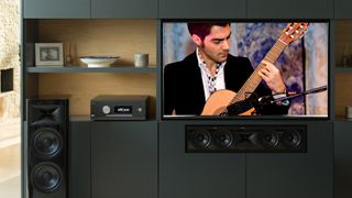 Arcam AVR30 on a TV unit with speakers and a TV