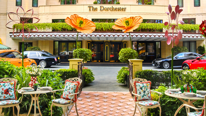 the dorchester courtyard decorated by La Double J with patterned floor tiling and large floral sculptures