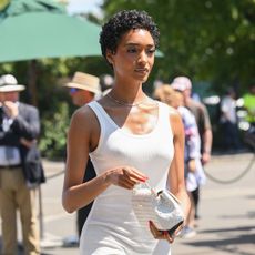 best celebrity summer beauty: Jourdan Dunn wearing bronzed glowy skin with white dress