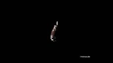 A far-away photograph of silver space debris